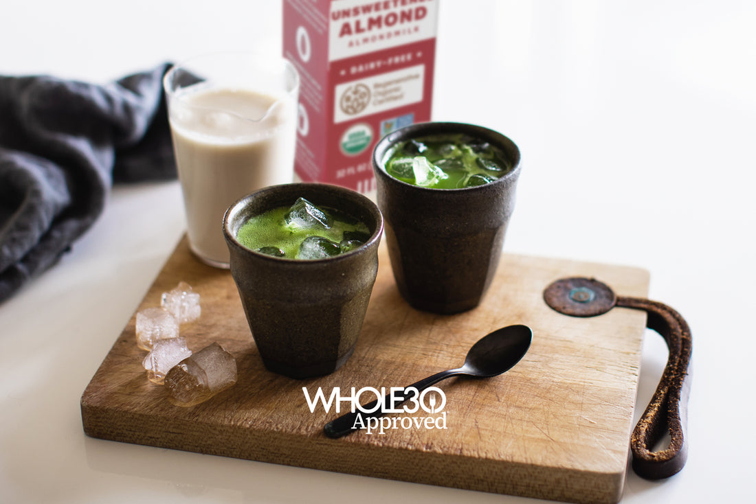 Two cups of matcha cortado, next to a glass of Malk. Copy reads "Whole30 Approved."