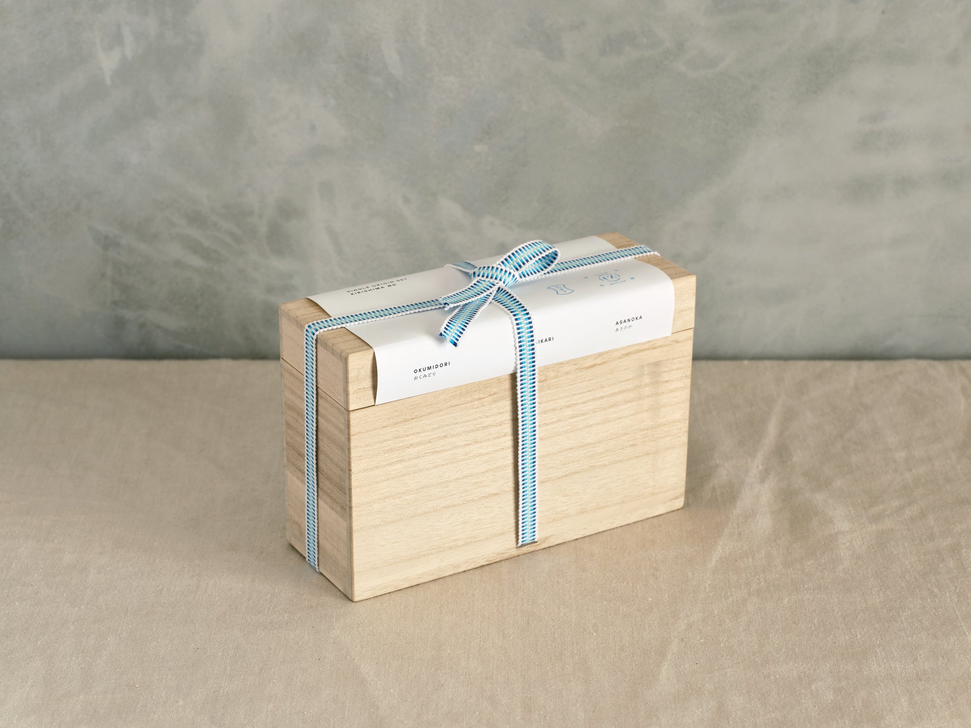  Single Origin Box Set, packaged in a kiri bako with a blue ribbon.
