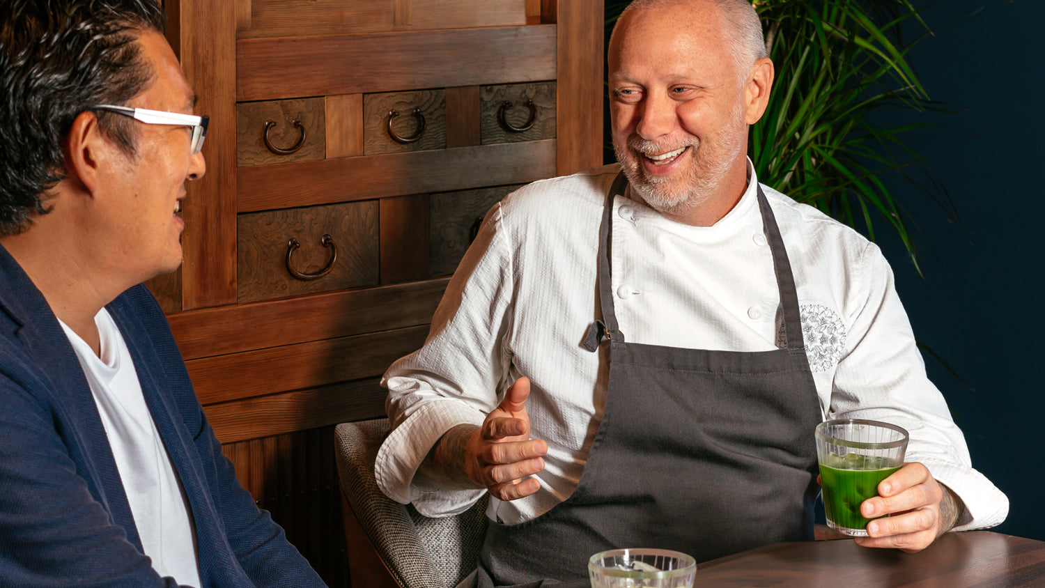 SingleThread’s chef Kyle Connaughton laughs with Cuzen Matcha CEO Eijiro Tsukada over glasses of sparkling matcha.