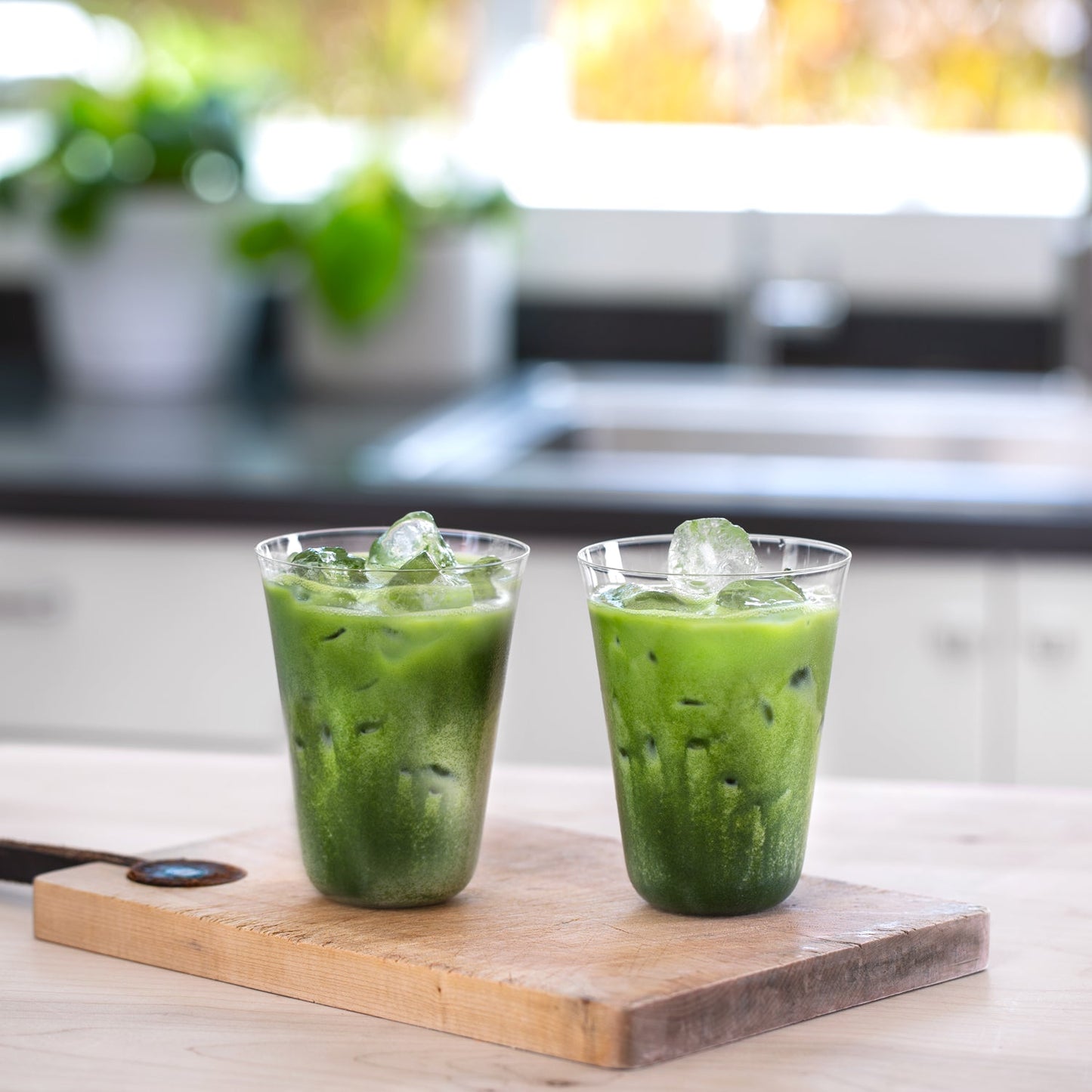 Two Perfect Matcha Latte Glasses display a beautiful show of green colors through the crystal-clear, paper thin glass.