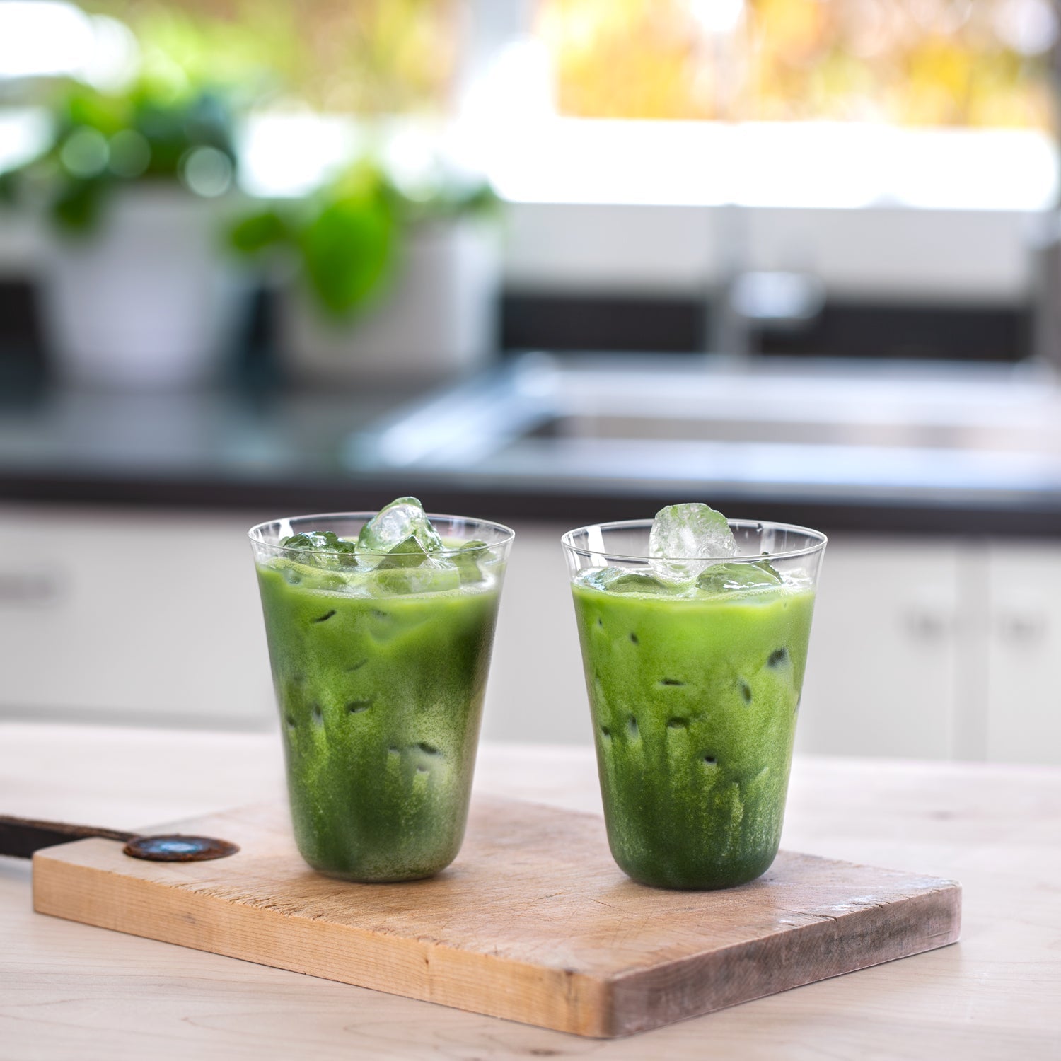Two Perfect Matcha Latte Glasses display a beautiful show of green colors through the crystal-clear, paper thin glass.