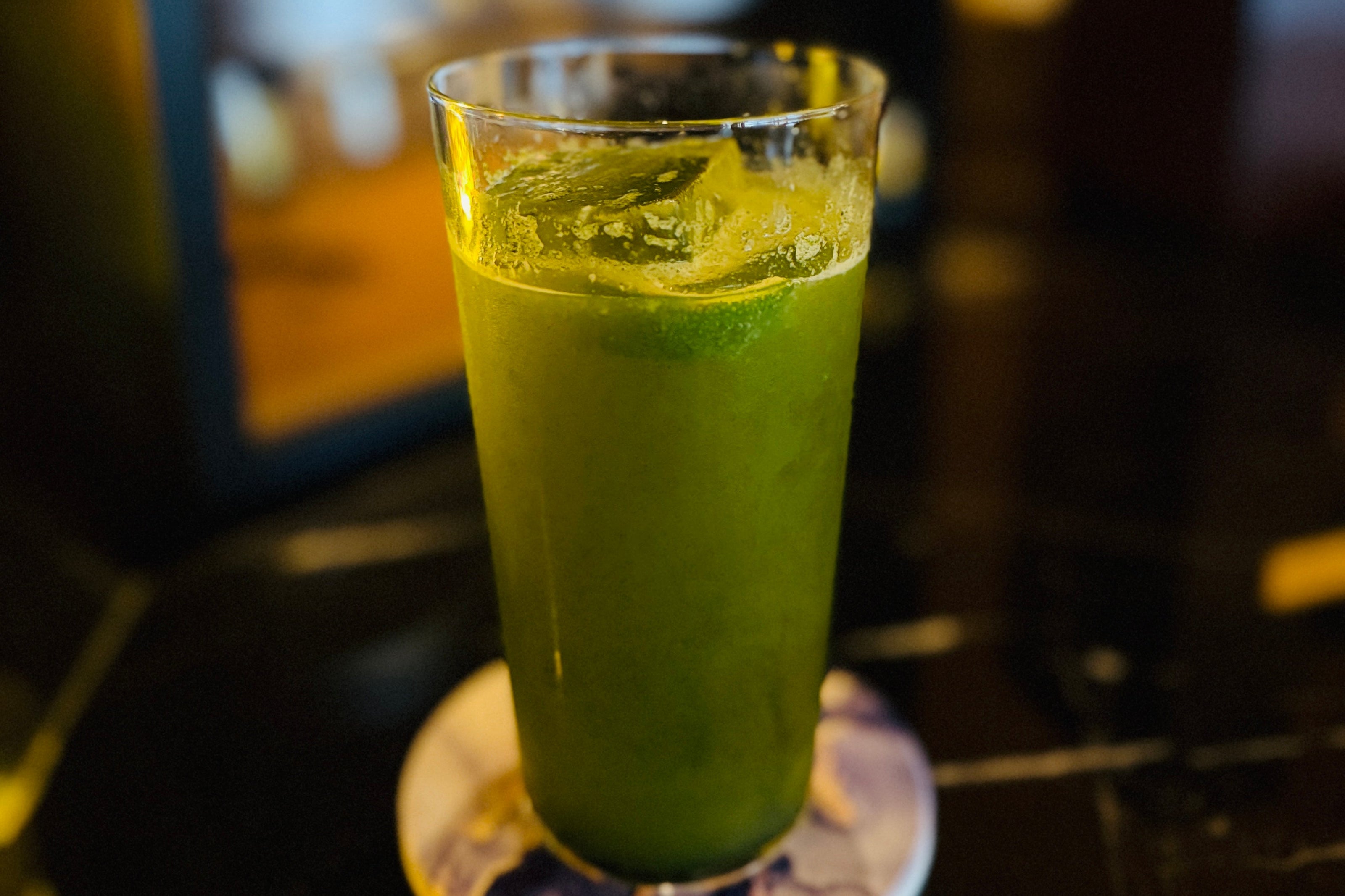 A bright green iced matcha mocktail at Toshiro's Bar.